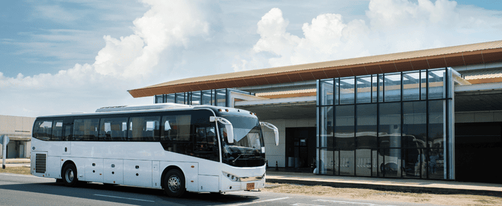 An airport shuttle waiting to pick up clients